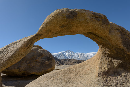 Mount Whitney seen through The Mobius Arch in Alabama Hills in the Eastern Sierra,California