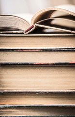Stack of old books, close up, front view. Reading,schooling or education concept