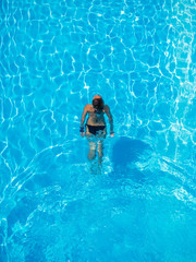 woman swimming in the pool