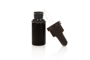 Medicine dropper Bottle on white.