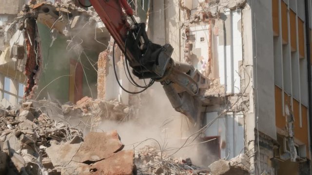 demolition of the building, demolition work, excavator at work