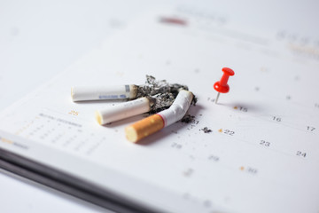 Cigarette on the calendar Concept of quitting smoking