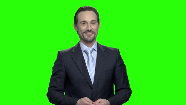 Portrait of mature caucasian positive business man. Green hromakey background for keying.