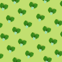 Tropical palm monstera leaves lies in a pastel pails on a colored background. Flat lay trendy...