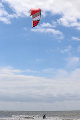 kitesurfer riding his board