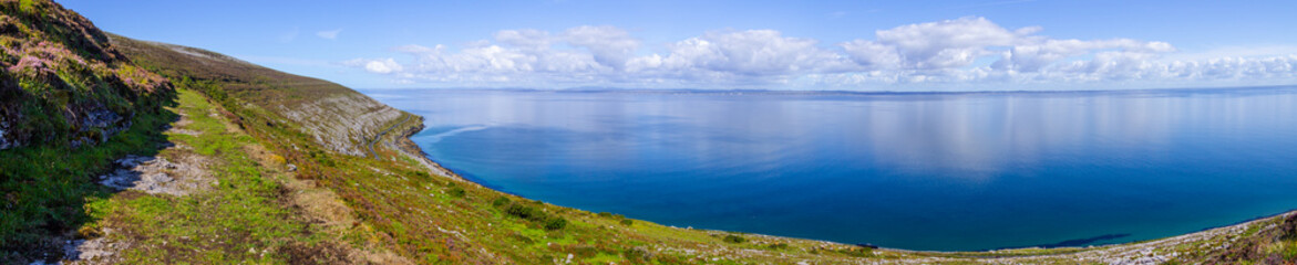 Burren way trail with Galway bay in background - obrazy, fototapety, plakaty