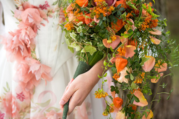 wedding bouquet in hands of bride