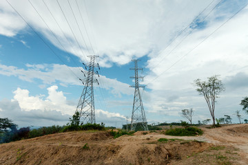 Electricity high voltage pole blue sky background.