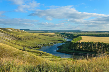 Fototapeta premium The little river and hills of the Volga region. Russia, Shilovka.