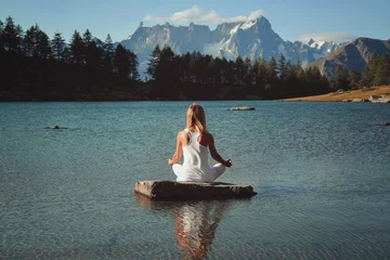 Foto op Canvas Woman meditation in mountain lake © captblack76