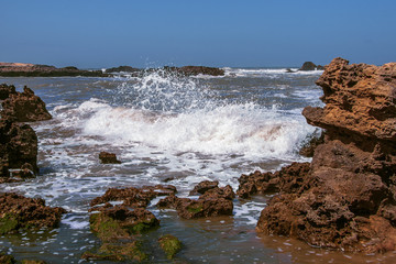 waves crashing on rocks