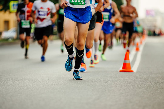 Athlete Runner Run Ahead Of Large Group Runners In Marathon