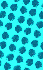 Tropical palm monstera leaves lies on a pastel colored paper. Nature summer concept pattern. Flat...