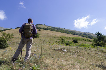 Fototapeta na wymiar Hiker on the summit of a mountain