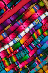 colorful fabric as seen on the markets of mexico and peru - 221584221