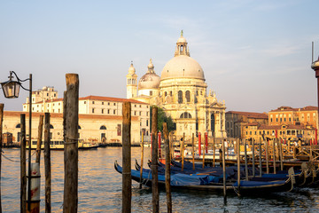 Fototapeta na wymiar Venetian Church at Sunrise with Gondola