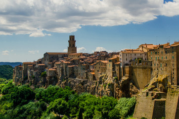 Fototapeta na wymiar View on old town of Pitigliano with clouds on the sky, Italy