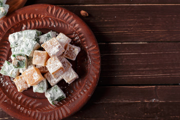 Turkish delight on a wooden table.