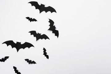 halloween and decoration concept - paper bats flying