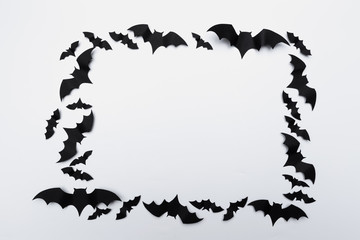 halloween and decoration concept - paper bats flying