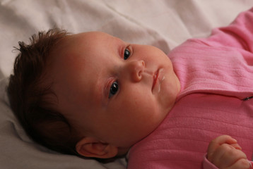 Portrait of the baby of the girl. Cute baby girl.