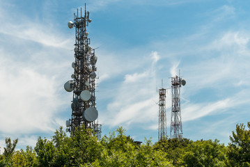 Iron Telecommunication tower with group of parabolic antennas.