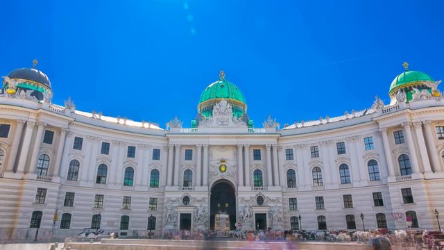Hofburg Palace seen from Michaelerplatz on a summer sunny day. Time lapse.