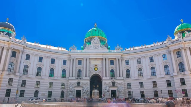 Hofburg Palace seen from Michaelerplatz on a summer sunny day. Time lapse.