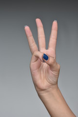 Female Teen Hand Counting Three