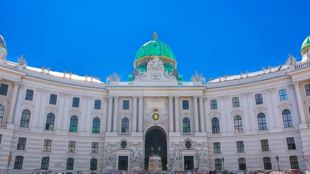 Hofburg Palace seen from Michaelerplatz on a summer sunny day. Time lapse. Camera moves from the bottom up. 