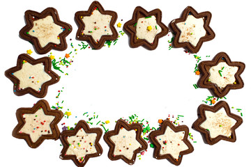 Chocolate biscuit in the form of an asterisk with white icing inside. Isolate, cookies on a white...