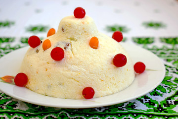 Delicious curd dessert for Christmas. Dish of cottage cheese with berries decorated.
