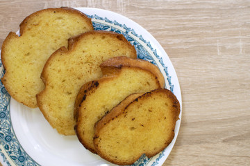 Toasted breads on the white plate for breakfast. French toast