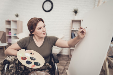 Disabled Soldier In Wheelchair Draws A Picture.