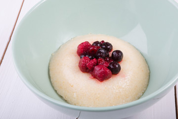 Millet porridge served with berries