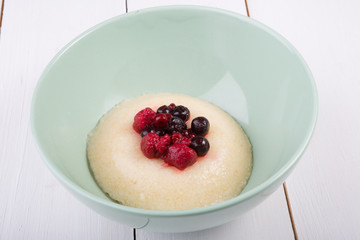 Millet porridge served with berries