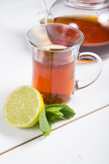 Hot black tea served with lime