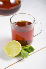 Hot black tea served with lime