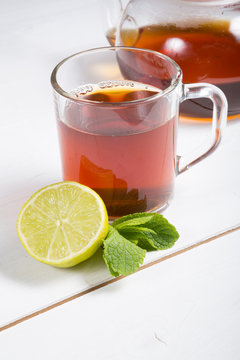 Hot black tea served with lime