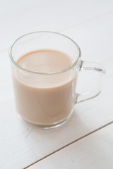 Glass mug of hot cocoa coffee drink