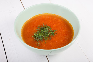 Red soup with herbs