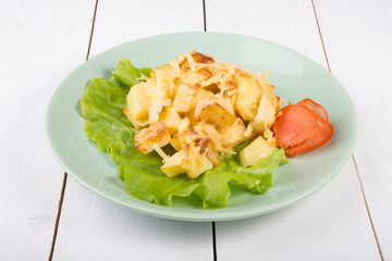Fried potatoes with melted cheese