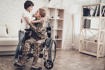 Fototapeta premium Woman Veteran In Wheelchair Homecoming Concept.