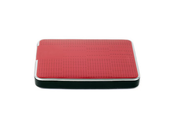Red external hard drive for data storage and security. Portable disk hdd isolated on white...