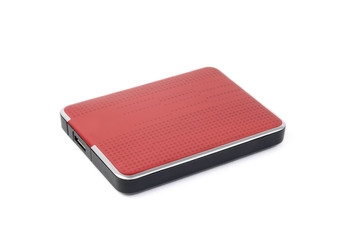 Red external hard drive for data storage and security. Portable disk hdd isolated on white background.