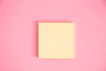 Set of yellow stick paper notes on color background.