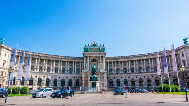  Hofburg Palace - Neue Burg seen from the Heldenplatz on a summer sunny day. Time lapse. Zoom out effect