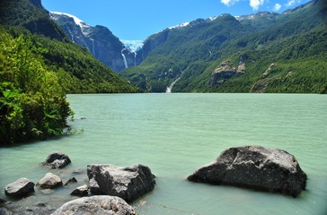 Glacier lagoon or lake with green water, with view of a hanging glacier and some waterfalls, in Queulat National Park, Chile