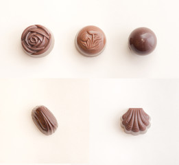 Chocolate sweets isolated / Collection of five different filled chocolates / Top view of chocolate candies isolated on white background with soft light and shadows