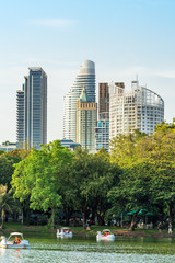 Fototapeta premium Swan paddle boats on the lake in the Lumphini Park Bangkok